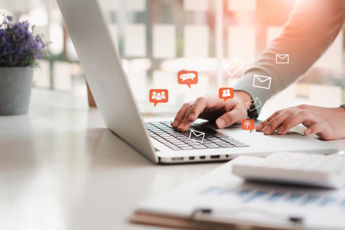 Managing social media messages and community interactions on a laptop