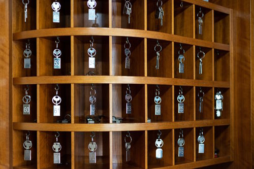 hotel reception with traditional key rack in older property for sale