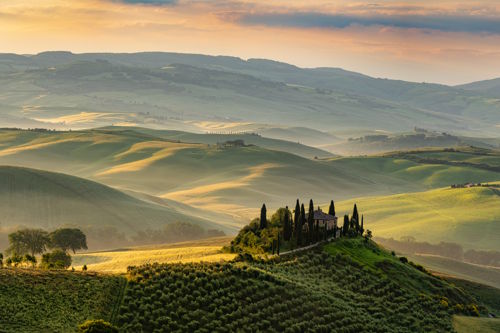 sustainable luxury tourism in countryside landscape with rolling hills and vineyard scenery representing slow travel and nature-based hospitality
