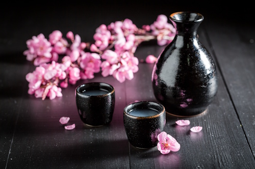 sake in hospitality Japanese rice wine bottle and cups food pairing concept